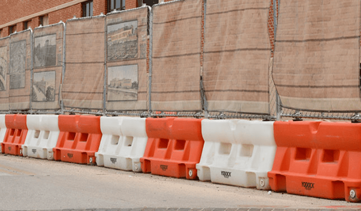 Water-Filled Barriers and Fence Toppers in Vertical Construction